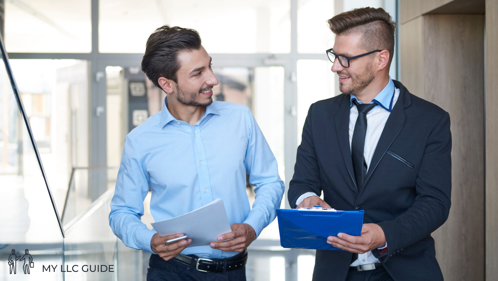 two business men talking in an office