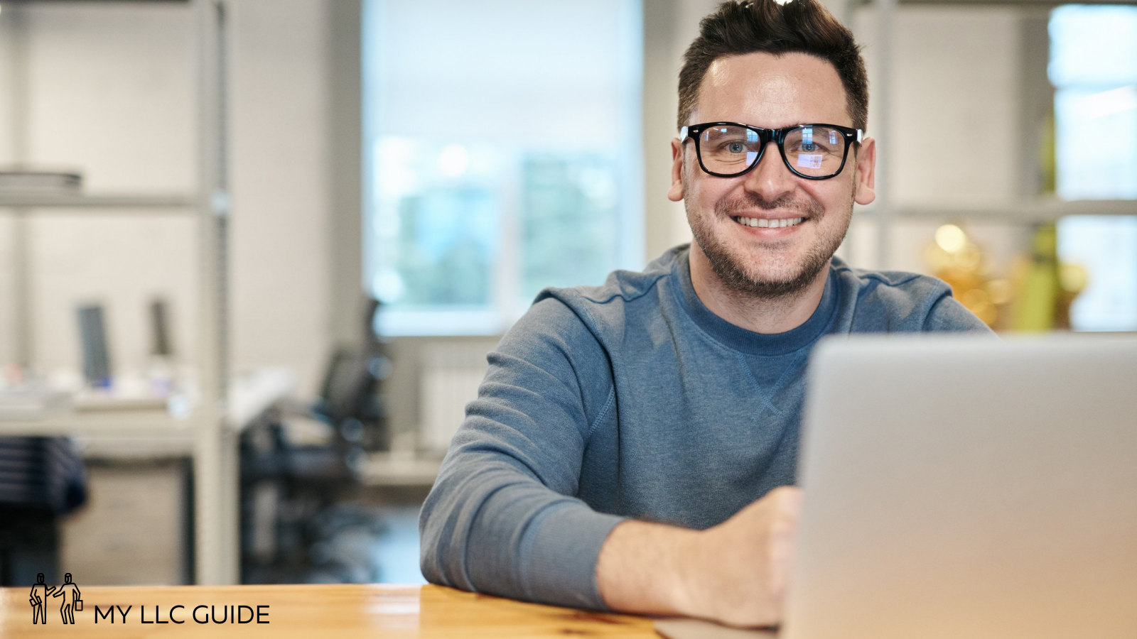 man on laptop opening an LLC bank account