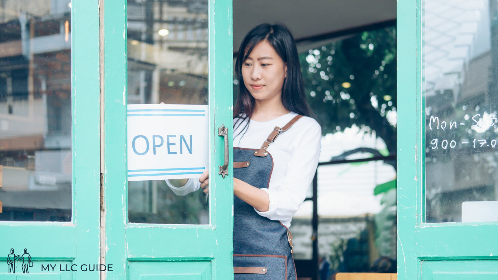 business owner standing at premesis door