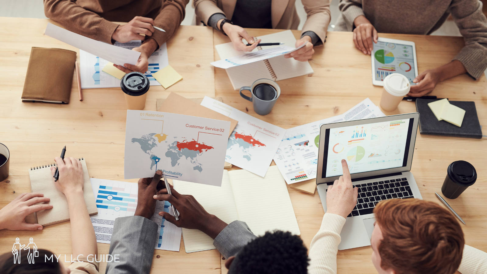 group of people working at a large desk