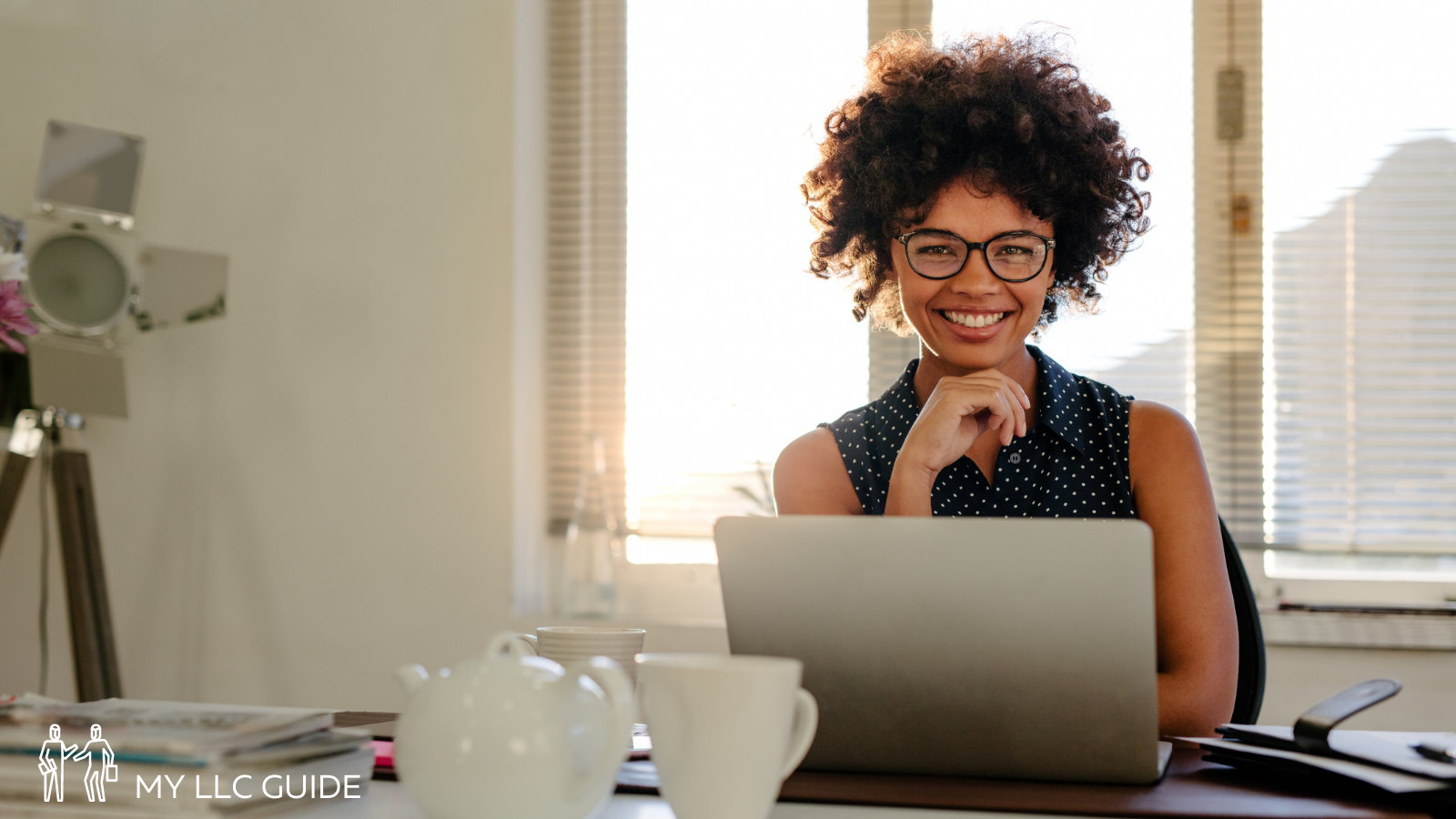 an LLC registered agent at a desk