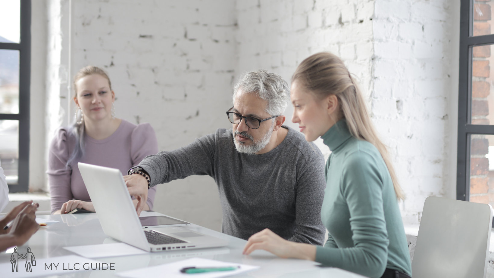 man and woman at a desk in an office