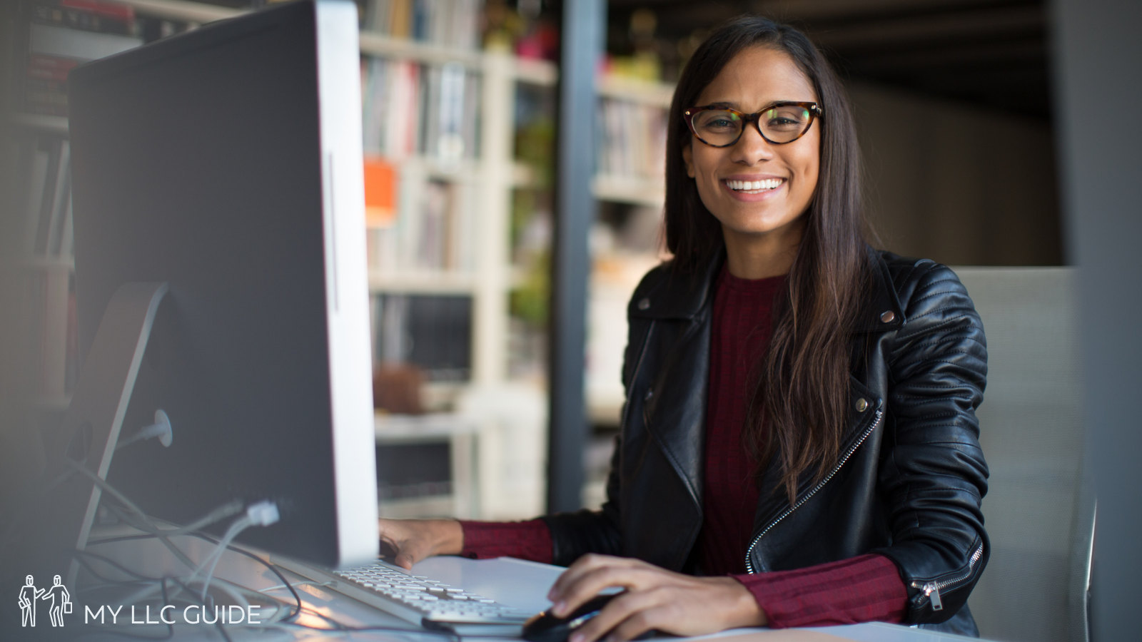 office worker sitting at desk and smiling