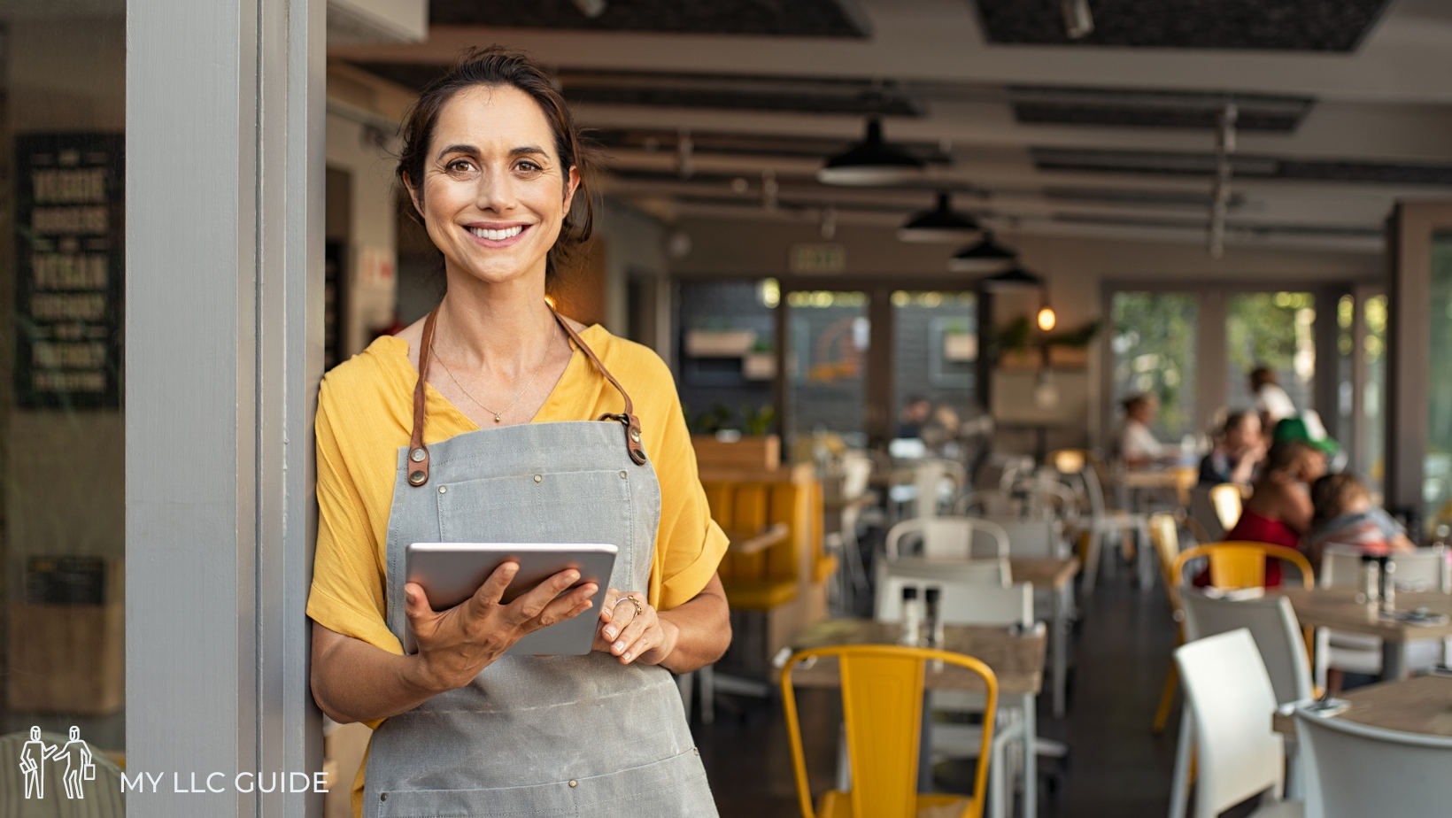 illinois LLC business owner standing outside a cafe