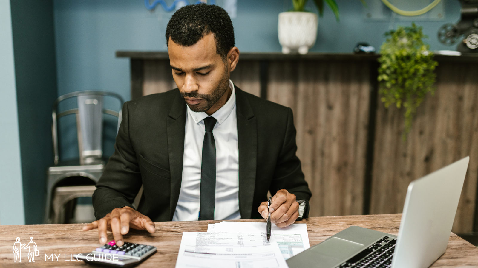 a registered agent sitting behind a desk