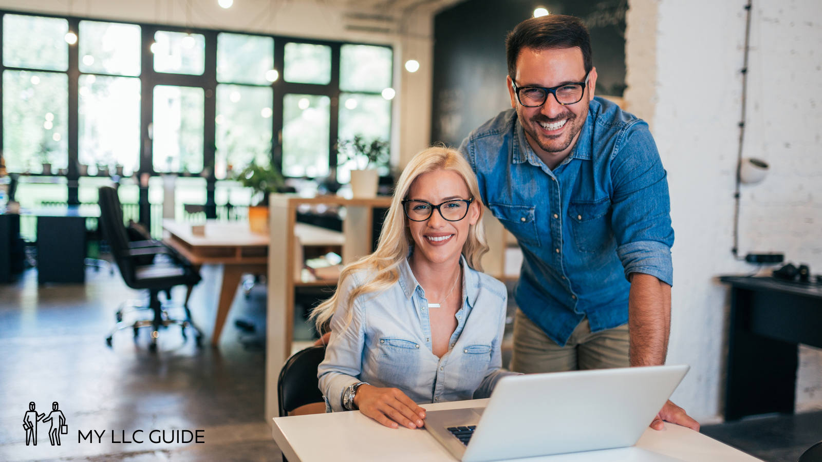 man and woman at a desk in an office