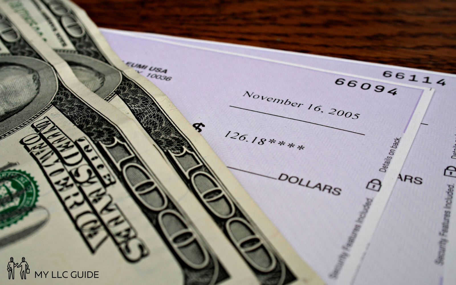 dollar bills resting on a high security check