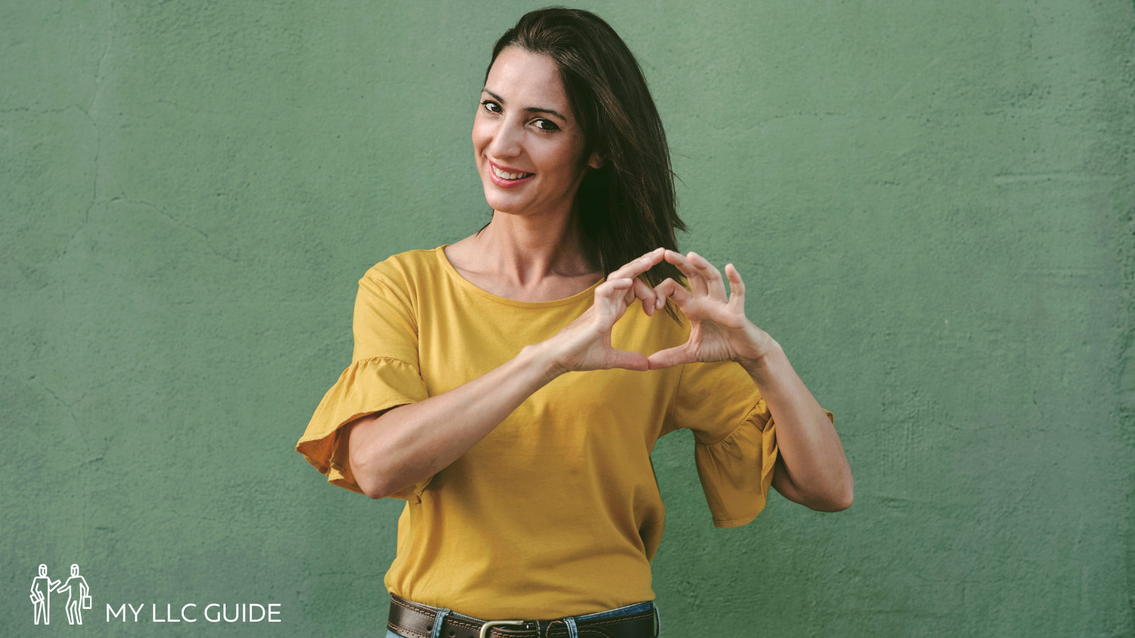 woman making a hand gesture and smiling