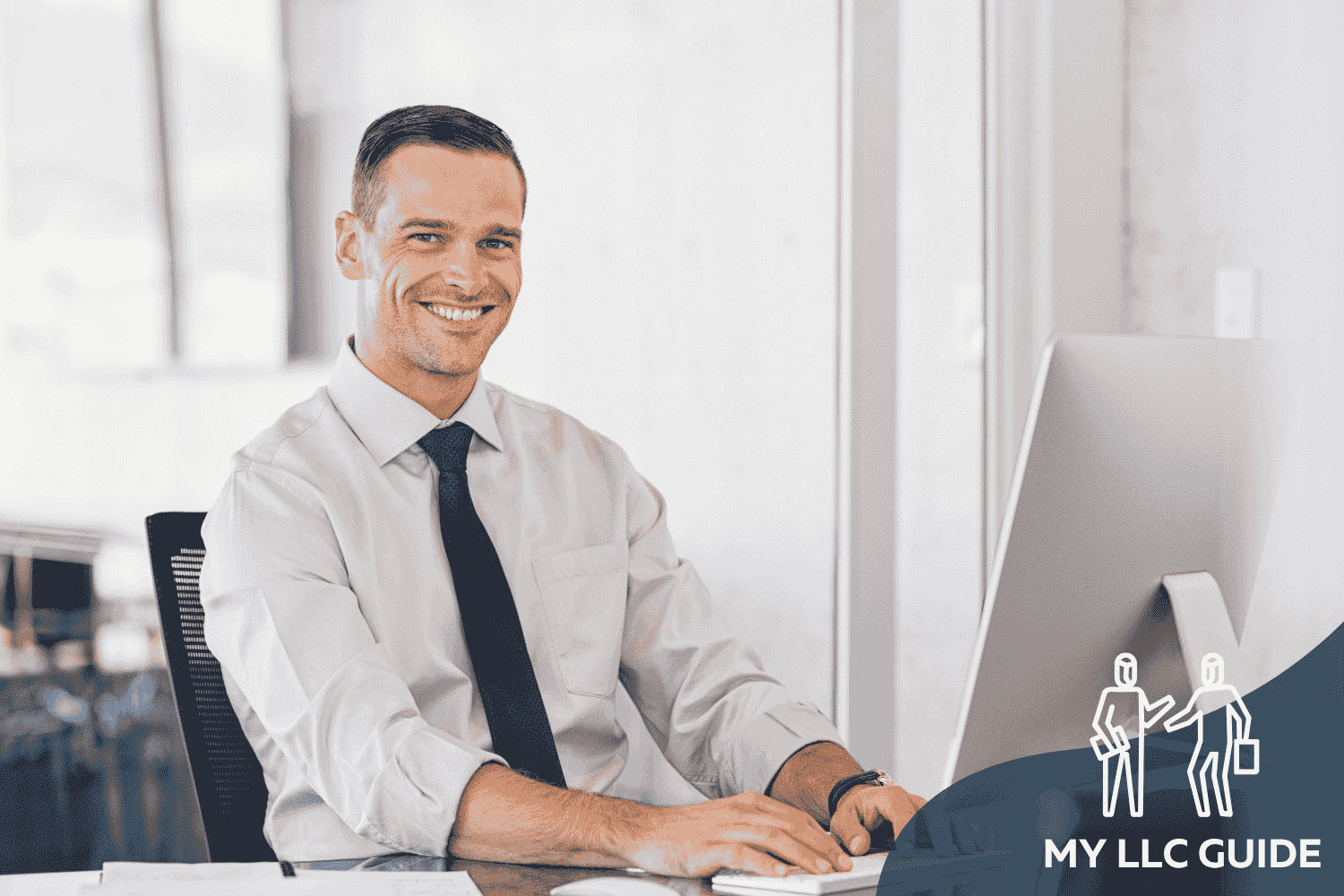 MAN WORKING AT COMPUTER